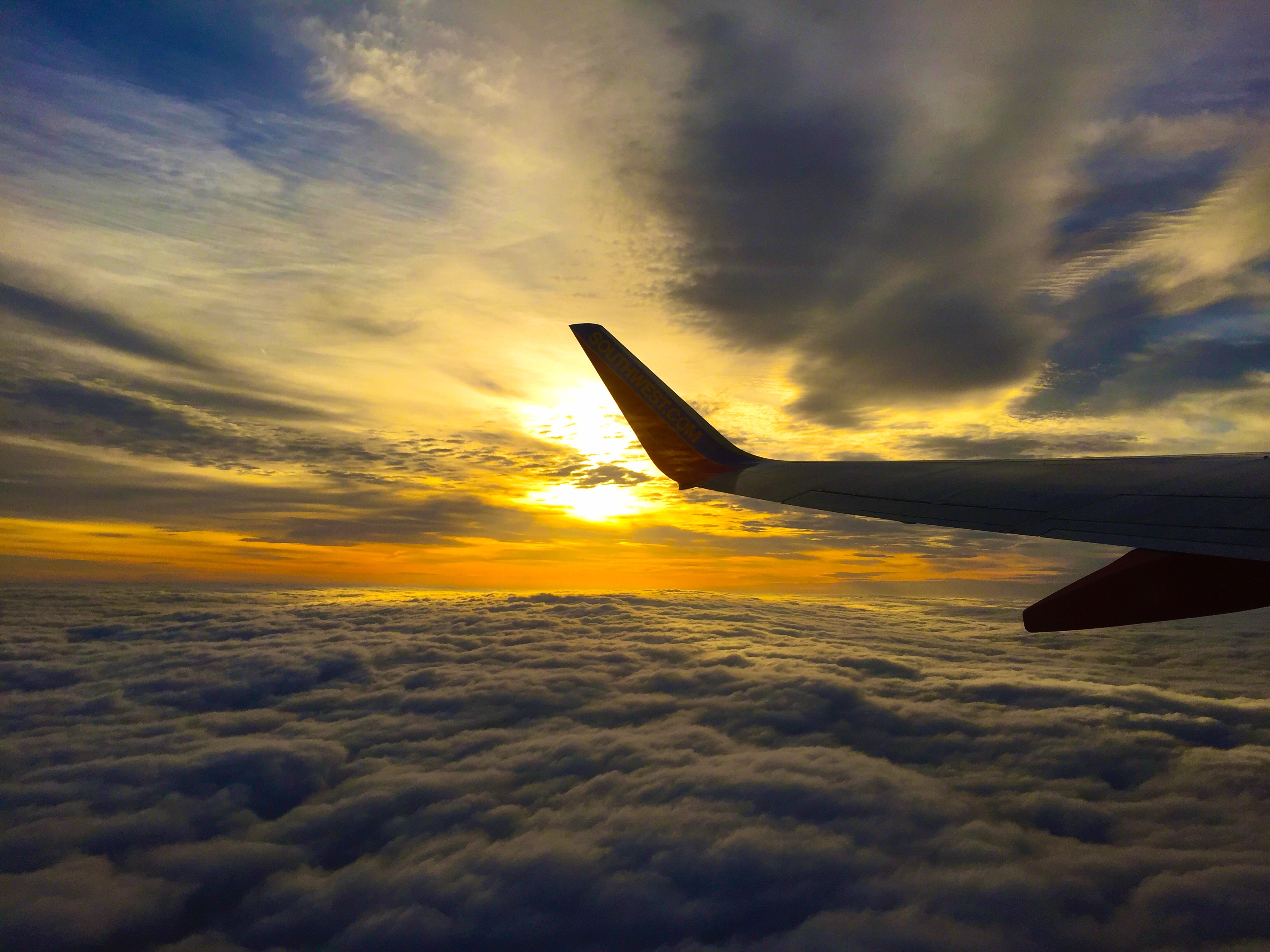 pexels-photo-plane wing sunset