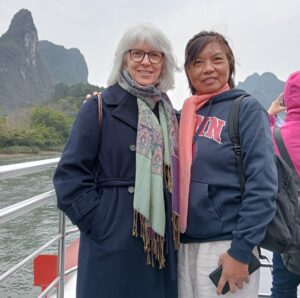 Tracey Gemmell poses with an unnamed friend on The Li River boat.
