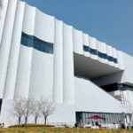 The exterior white sculptured walls of the Shanghai Museum East.
