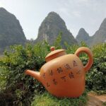 A teapot sculpture on the Yulong River